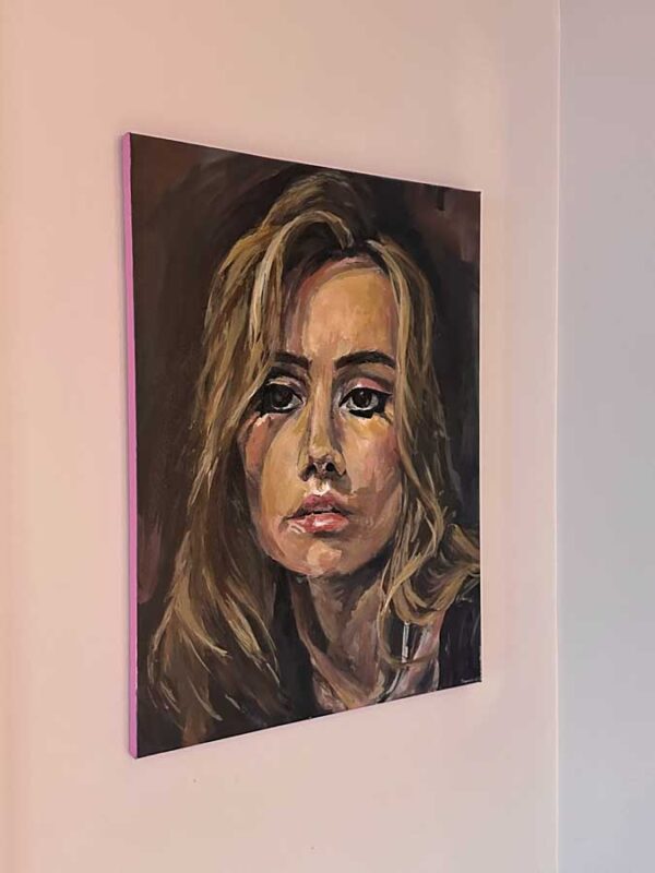Original artwork using high-gloss acrylic paint. A neutral toned portrait up for sale. This image shows it from a side-view as it has painted borders.